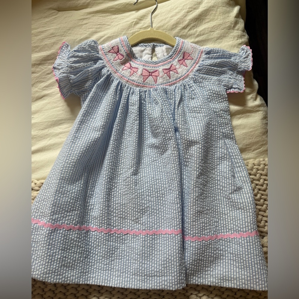 Girls' Light Blue Seersucker smocked dress with pink bows size 12-18m
